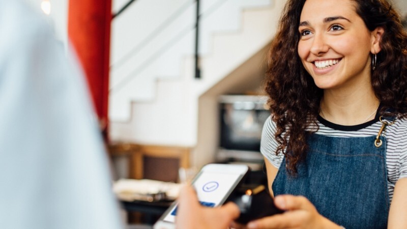 woman taking mobile payment